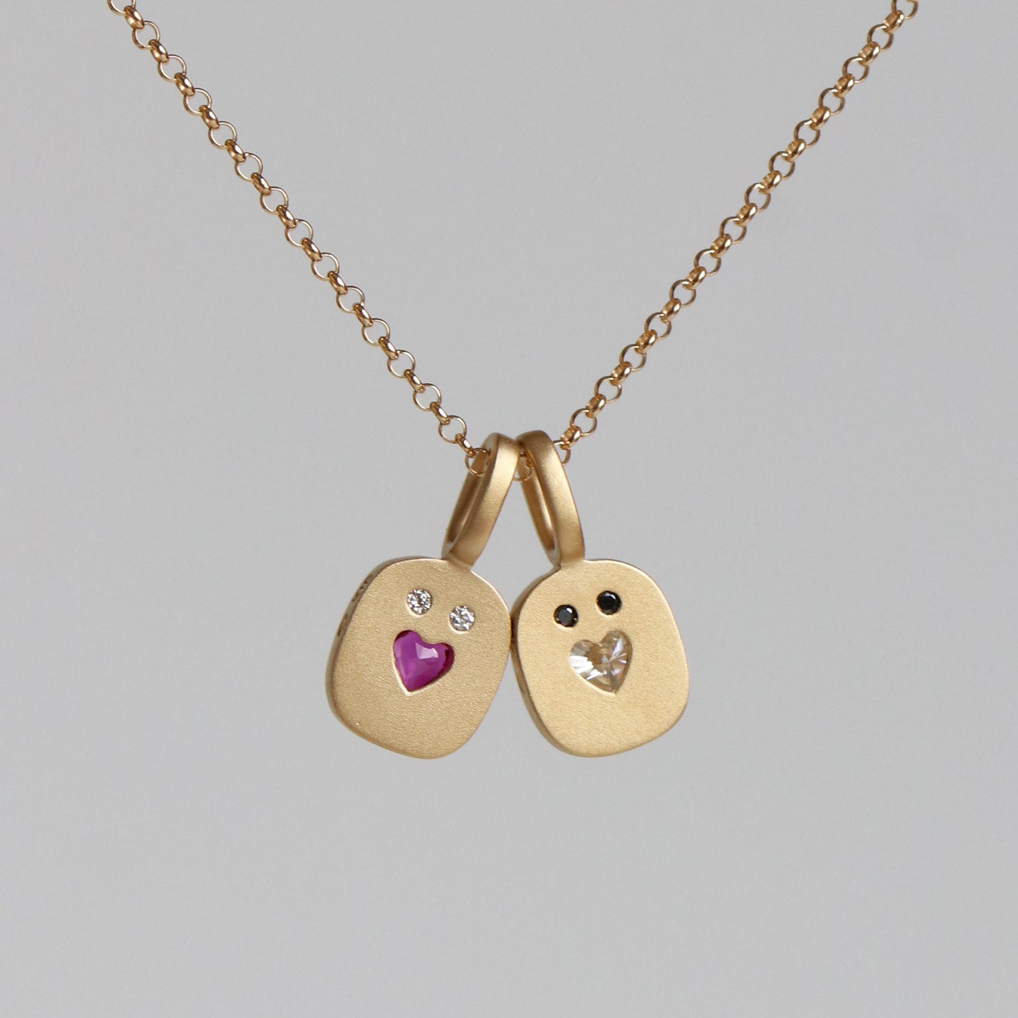 REVERSIBLE HEART SMILE CHARM