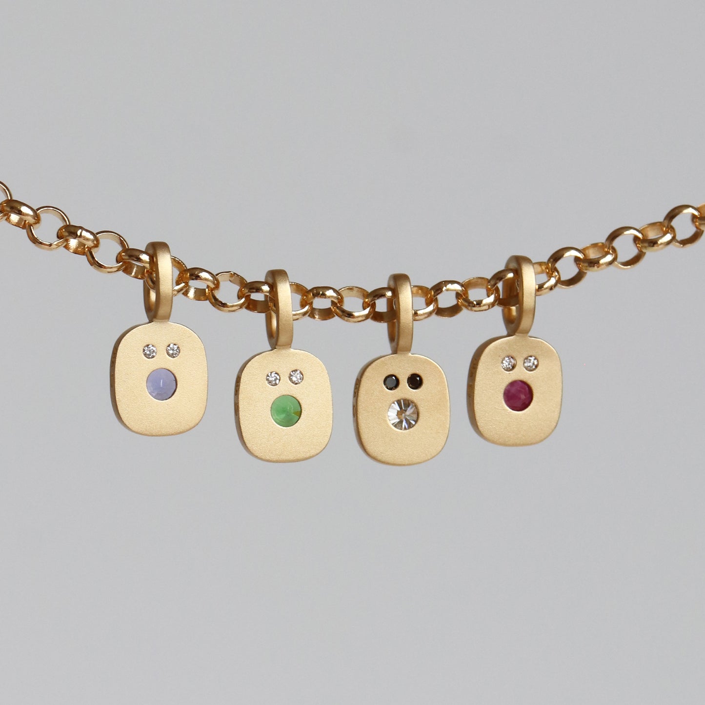 REVERSIBLE SMILE CHARM